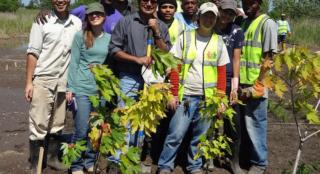 Professor Reddy and students planting trees