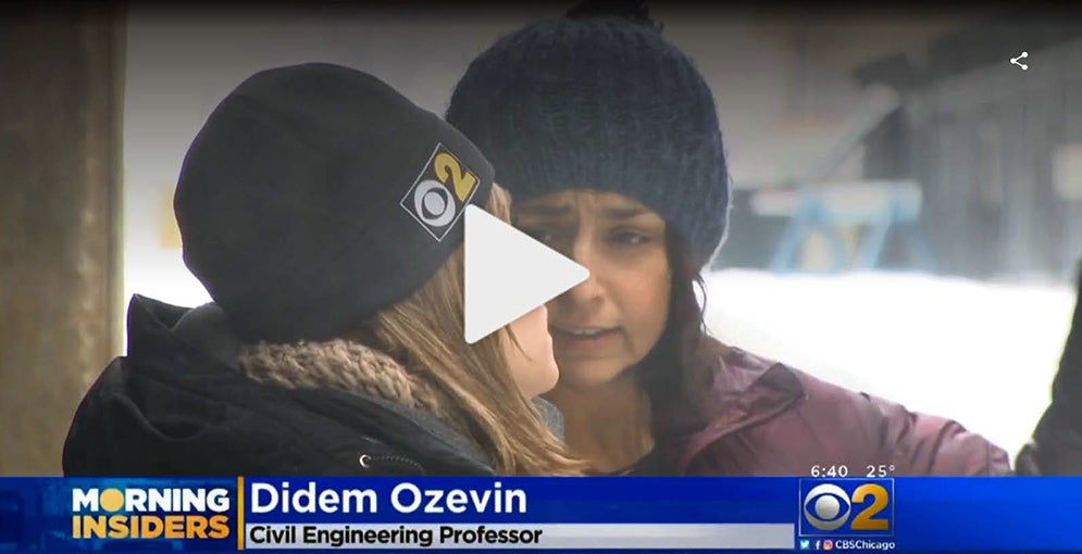 Professor Didem Ozevin talks with reporter