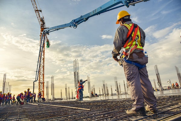 construction manager overseeing concrete pouring