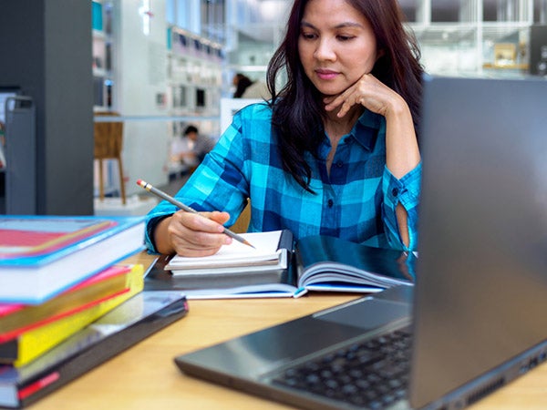 student working in library