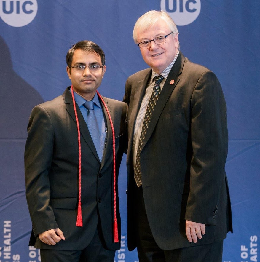 Sudheer Ballare, a PhD candidate at UIC, and UIC Chancellor Michael D. Amiridis