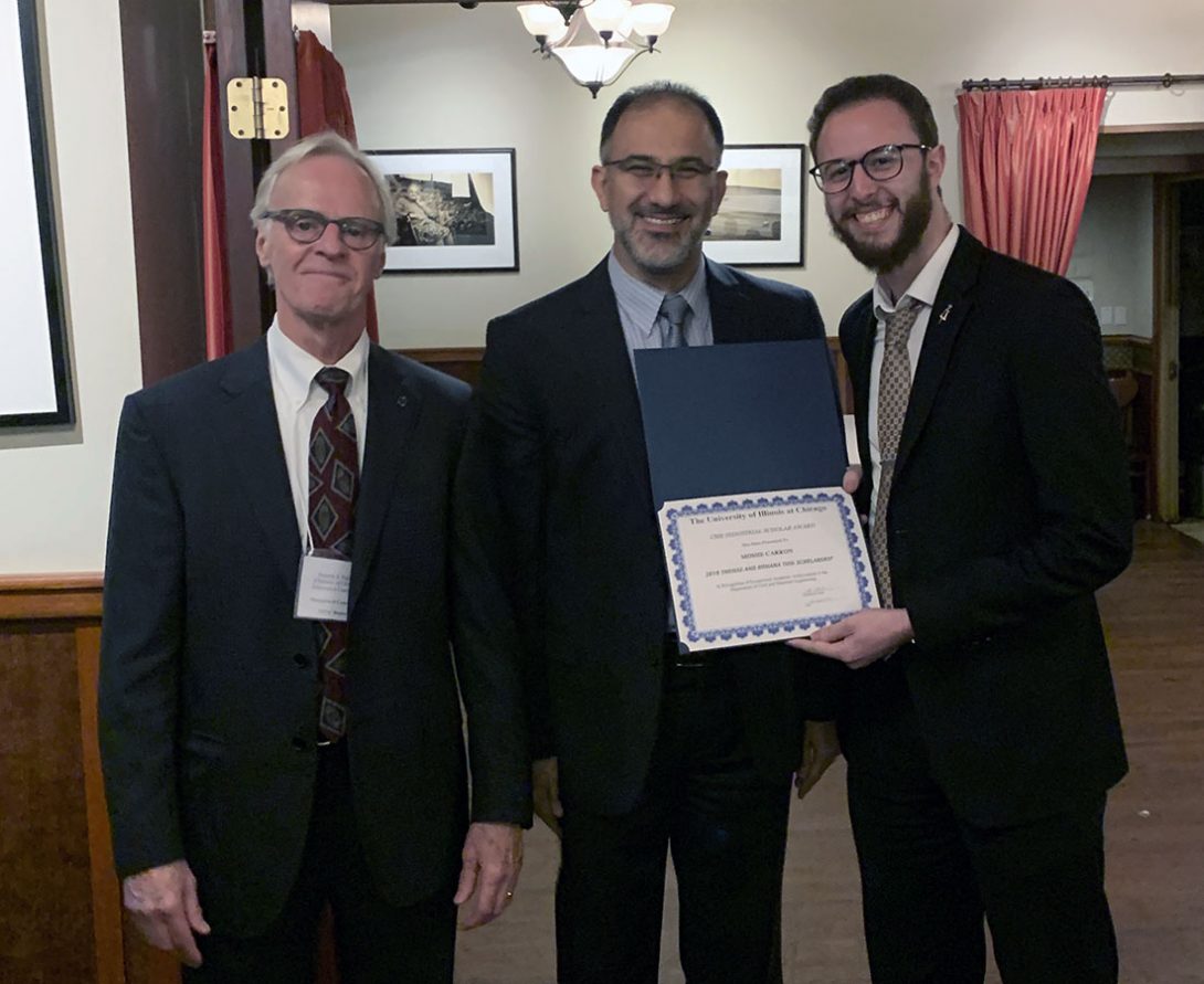 Ken Nelson and CME Department Head Abolfazl (Kouros) Mohammadian with a student receiving a scholarship at UIC